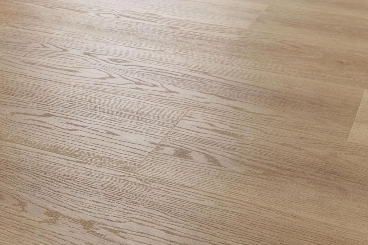 Harmaanruskean vinyylilankun pinta lähikuvassa